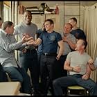 After pulling a prank on a rookie firefighter, Jack Morrison (Joaquin Phoenix, center) jokes with his comrades at the firehouse, including (Left to right) Ray Gauquin (Balthazar Getty), Captain Kennedy (John Travolta,), Don Miller (Kevin Daniels), Tommy Drake (Morris Chestnut), Frank McKinney (Kevin Chapman), Ed Reilly (Robert Lewis), Lenny Richter (Robert Patrick), and Keith Perez (Jay Hernandez).