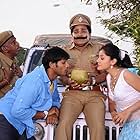 Mohammad Ali, Manoj Kumar Manchu, and Taapsee Pannu in Jhummandi Naadam (2010)