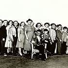 (Far Left) Richard Long, "Tom Kettle." Center seated, Percy Kilbride "Pa Kettle" & J.P. Sloane "Billy Kettle." Standing behind Pa, Marjorie Main, "Ma Kettle"