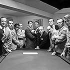 Frank Sinatra, Norman Fell, Dean Martin, Richard Conte, Sammy Davis Jr., Richard Benedict, Joey Bishop, Clem Harvey, Peter Lawford, Buddy Lester, Henry Silva, and Akim Tamiroff in Ocean's Eleven (1960)