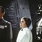 Carrie Fisher, James Earl Jones, Peter Cushing, and David Prowse in Star Wars: Episode IV - A New Hope (1977)