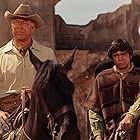 George Kennedy and Reni Santoni in Guns of the Magnificent Seven (1969)