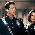 Sandra Bullock and Sylvester Stallone in Demolition Man (1993)