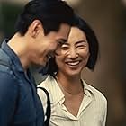 Teo Yoo and Greta Lee in Past Lives (2023)