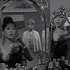 Jacqueline Chan and Sylvia Syms in The Saint (1962)