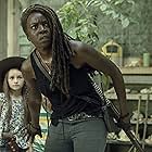 Antony Azor, Danai Gurira, and Cailey Fleming in The Walking Dead (2010)