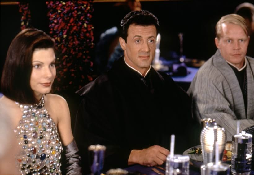 Sandra Bullock and Sylvester Stallone in Demolition Man (1993)
