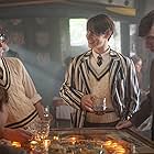 Harry Lloyd, Eddie Redmayne, and Gruffudd Glyn in The Theory of Everything (2014)