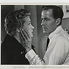 Nina Foch and Hugh Marlowe in Illegal (1955)