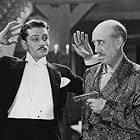 Laurence Olivier and A. Bromley Davenport in Too Many Crooks (1930)