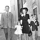 Joan Blondell, Dick Powell, Ellen Powell, and Norman S. Powell