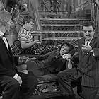 John Astin, Ted Cassidy, Penney Parker, and Ken Weatherwax in The Addams Family (1964)