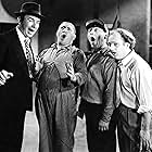 Moe Howard, Larry Fine, Ted Healy, and Curly Howard in Dancing Lady (1933)