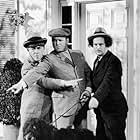 Moe Howard, Larry Fine, Curly Howard, and The Three Stooges