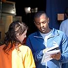 Noel Clarke giving notes to Emma Roberts on the set of 4.3.2.1