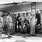 James Stewart, Richard Attenborough, Ernest Borgnine, Ian Bannen, George Kennedy, Dan Duryea, Peter Finch, Ronald Fraser, and Christian Marquand in The Flight of the Phoenix (1965)