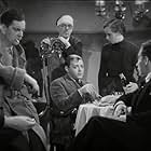 Peter Lorre, Leslie Banks, Cicely Oates, and S.J. Warmington in The Man Who Knew Too Much (1934)