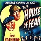 Basil Rathbone, Nigel Bruce, Paul Cavanagh, Harry Cording, Holmes Herbert, Dennis Hoey, Aubrey Mather, and Gavin Muir in The House of Fear (1945)