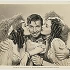 Barbara Brewster, Gloria Brewster, and Bruce Cabot in The Flame of New Orleans (1941)