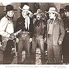 Frank Ellis, Art Fowler, Herman Hack, Edward Howard, Charles King, Dave O'Brien, Tex Ritter, and Jack Hendricks in Three in the Saddle (1945)