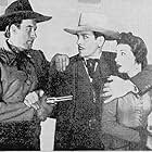 Bill Elliott, Kenneth MacDonald, and Carmen Morales in The Valley of Vanishing Men (1942)