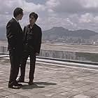 Tony Leung Chiu-wai and Anthony Chau-Sang Wong in Infernal Affairs (2002)