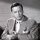 DeForest Kelley in Illegal (1955)