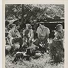 David Bruce, Billy Curtis, Tommy Farrell, Ann Savage, and Johnny Weissmuller in Pygmy Island (1950)