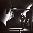 Raymond Burr and Dick Powell in Pitfall (1948)