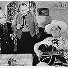 Harry Harvey, Fred Scott, and John Ward in Ridin' the Trail (1940)