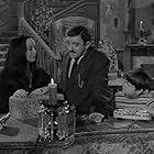 John Astin, Carolyn Jones, and Ken Weatherwax in The Addams Family (1964)