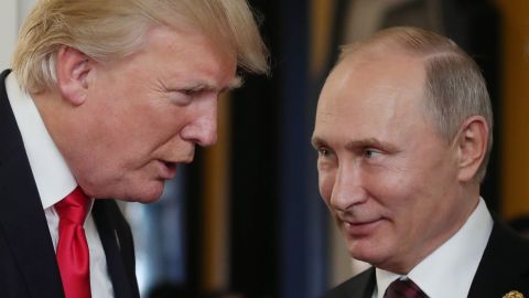 US President Donald Trump (L) chats with Russia&apos;s President Vladimir Putin as they attend the APEC Economic Leaders&apos; Meeting, part of the Asia-Pacific Economic Cooperation (APEC) leaders&apos; summit in the central Vietnamese city of Danang on November 11, 2017. (Photo by Mikhail KLIMENTYEV / SPUTNIK / AFP) (Photo by MIKHAIL KLIMENTYEV/SPUTNIK/AFP via Getty Images)