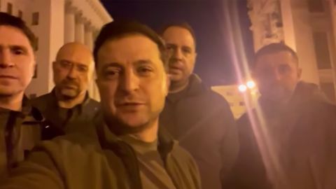 "We are here. We are in Kyiv. We are defending Ukraine."That was the title of a video posted on Facebook Friday night by Ukrainian President Volodymyr Zelensky, as he vowed to defend his country while standing on a Kyiv street with other leaders of his administration.