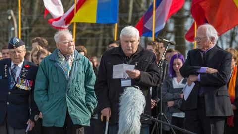 This picture taken on April 12, 2015 and handed out on March 21, 2022 by the Buchenwald and Mittelbau-Dora Memorials Foundation shows Holocaust survivor Boris Romanchenko (2nd R) as he stands next to other former prisoners of the Buchenwald Nazi concentration camp during a commemoration ceremony at the camp&apos;s memorial site in Buchenwald near Weimar, eastern Germany. - As the Buchenwald and Mittelbau-Dora Memorials Foundation said in a press release on March 21, 2022, Romanchenko, 96, was killed as his house in Kharkiv was hit by shelling during the Ukraine-Russia conflict. (Photo by Michael REICHEL / Buchenwald and Mittelbau-Dora Memorials Foundation / AFP) / RESTRICTED TO EDITORIAL USE - MANDATORY CREDIT "AFP PHOTO / Michael REICHEL / Buchenwald and Mittelbau-Dora Memorials Foundation" - NO MARKETING - NO ADVERTISING CAMPAIGNS - DISTRIBUTED AS A SERVICE TO CLIENTS (Photo by MICHAEL REICHEL/Buchenwald and Mittelbau-Dora Me/AFP via Getty Images)