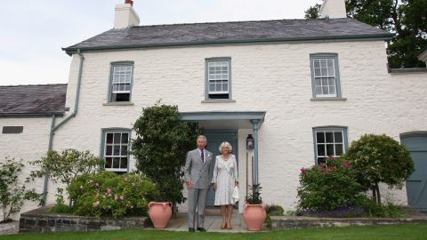 TRH Camilla, Duchess of Cornwall and Prince Charles, Prince of Wales pose for a photograph outside their welsh property Llwynywermod before a drinks reception on June 22, 2009 in Llandovery, United Kingdom. The Duchess of Cornwall and the Prince of Wales are on their annual &apos;Wales Week&apos; visit to the region and will be staying at the recently refurbished property. 