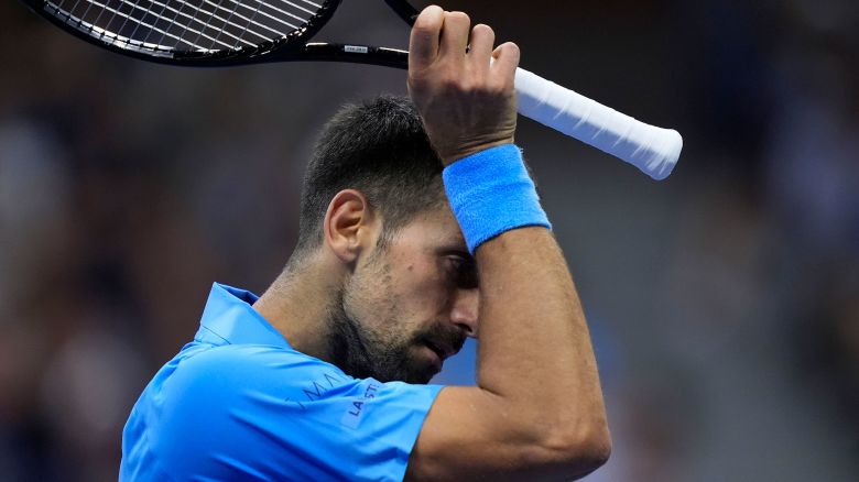 Novak Djokovic, of Serbia, wipes his face against Alexei Popyrin, of Australia, during a third round match of the U.S. Open tennis championships, Friday, Aug. 30, 2024, in New York. (AP Photo/Julia Nikhinson)