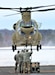 Students and staff with the 89B Ammunition Supply Course conduct sling-load training with a CH-47 Chinook crew at Sparta-Fort McCoy Airport on Feb. 7, 2022, at Fort McCoy, Wis. The Ammunition Supply Course, taught by Regional Training Site-Maintenance staff at Fort McCoy, is a four-week course that provides training for Soldiers who are reclassifying to the 89B military occupational specialty. The sling-load training is one of the last major training events during the course. A sling load is used to transport munitions to remote locations or to expedite shipments in hostile locations. The CH-47 crew is with the Army Reserve’s 7th Battalion, 158th Aviation Regiment of New Century, Kansas. (U.S. Army Photo by Scott T. Sturkol, Public Affairs Office, Fort McCoy, Wis.)