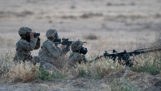 Soldiers assigned to the 76th Operational Response Command scanned the perimeter for enemy movement from their listening post/observation post during a simulated chemical attack on the Division Support Area during the Red Dragon 24 training at Dugway Proving Ground, Utah, on June 21, 2024. Exercise Red Dragon 24 helped enhance military units' readiness and response capabilities in dealing with potential Chemical, Biological, Radiological, and Nuclear (CBRN) incidents, ensuring better preparedness for real-world threats.