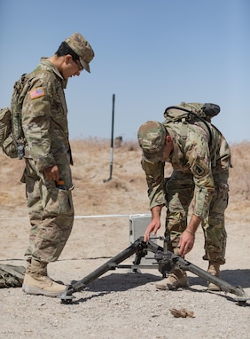 Pvt. Brandon Flores (left) and Spc. Zane Alam (right), assigned to the 369th Chemical Company, 76th Operational Response Command, assembled the Browning M2 .50-caliber Machine Gun tripod at the weapon's training during the Red Dragon 24 training at Dugway Proving Ground, Utah, on June 15, 2024. During weapon training, Chemical, Biological, Radiological, and Nuclear (CBRN) Soldiers familiarize themselves with the M2, learning its components, operation, and maintenance procedures.