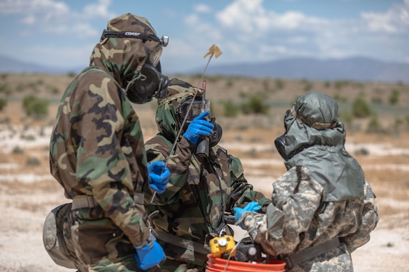 Soldiers assigned to the 76th Operational Response Command realized a pre-entry brief before examining a Chemical, Biological, Radiological, and Nuclear (CBRN) target during the Red Dragon 24 training at Dugway Proving Ground, Utah, June 21, 2024. CBRN Soldiers are responsible for conducting reconnaissance, chemical detection identification, biological agent collection, sampling, decontamination of personnel, equipment, casualties, and individual protective measures in first aid for unit personnel.