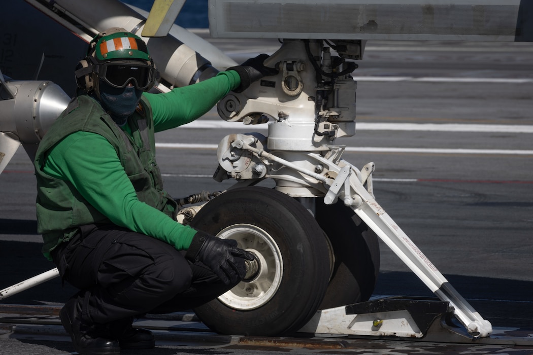 ABE2 Malcom Grandison directs an F/A-18E Super Hornet from VFA-31 aboard USS Gerald R. Ford (CVN 78) in the Atlantic Ocean.