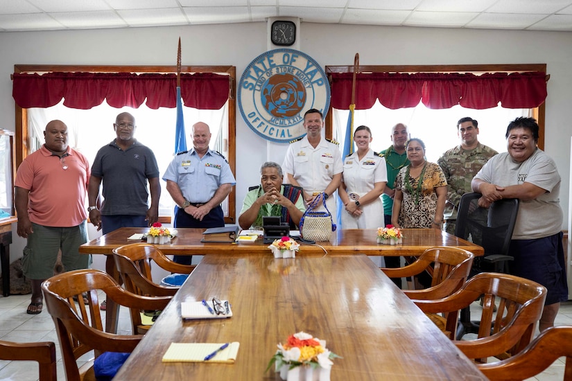 A group of people pose for a picture.