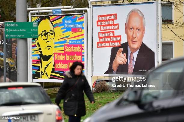 Election campaign billboards for the top candidates Oliver Luksic and Oskar Lafontaine pictured on March 6, 2017 in Saarbruecken, Germany. Saarland...