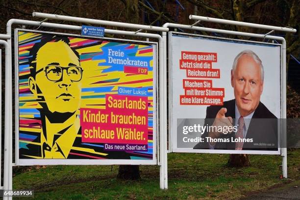 Election campaign billboards for the top candidates Oliver Luksic and Oskar Lafontaine pictured on March 6, 2017 in Saarbruecken, Germany. Saarland...