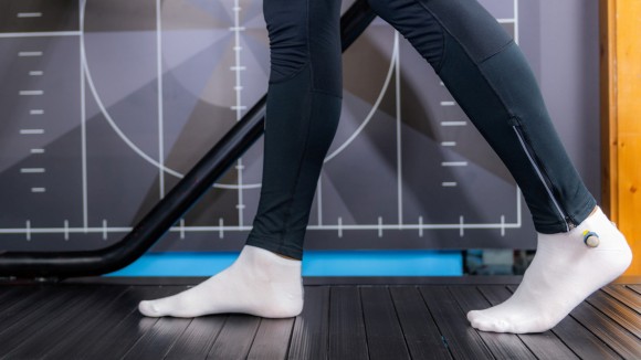 Person walking on a treadmill (gait anthropometric analysis) with legs and feet in view