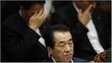 Japan"s Prime Minister Naoto Kan (C) sits in front of Trade Minister Banri Kaieda (L) and Goshi Hosono, the minister in charge of Japan"s nuclear crisis, during a budget committee meeting in the upper house of parliament in Tokyo July 7, 2011