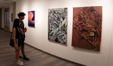 Guests looking at student work in the art building.