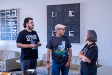 Faculty conversing in the art building.