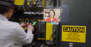 a woman working with her hands conferences with another woman via HoloLens technolgoy