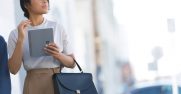 A woman holds a Surface Go